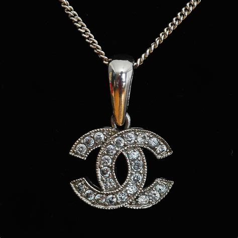 chanel long necklace with logo.